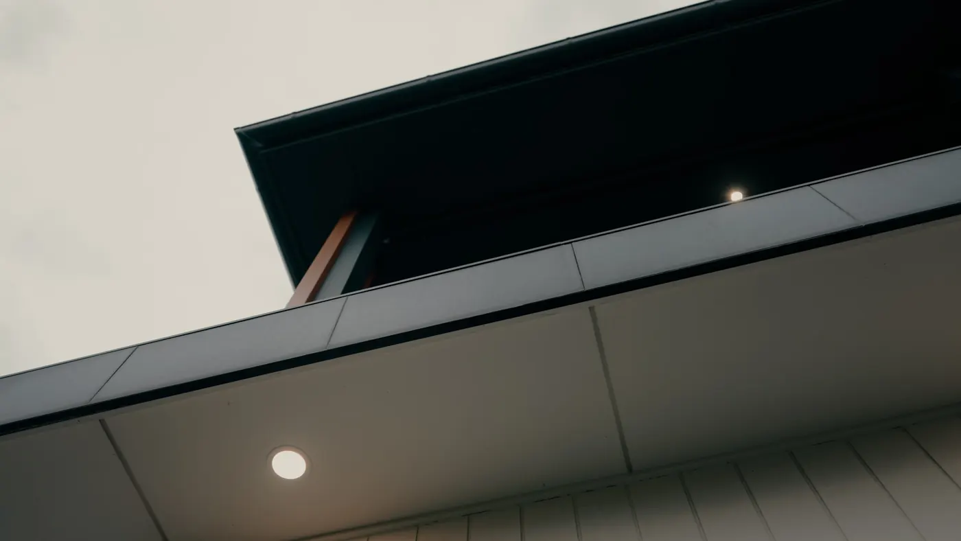 LED downlights set into the eave of a modern home